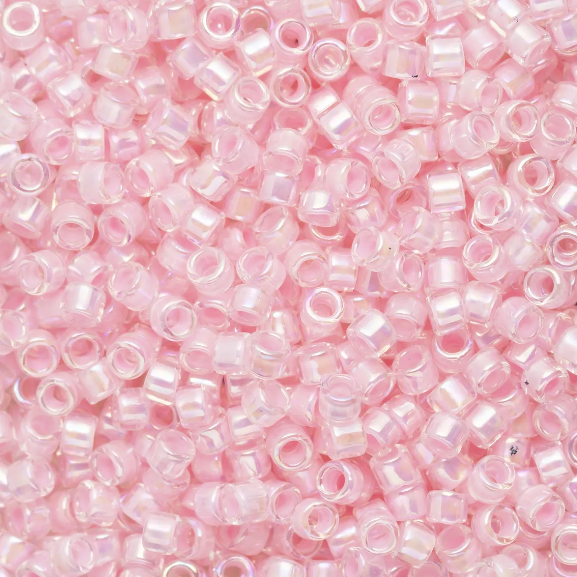TOHO-perler 11/0 – lyserosa rainbow, 780 IC rainbow crystal/bubble gum-lined