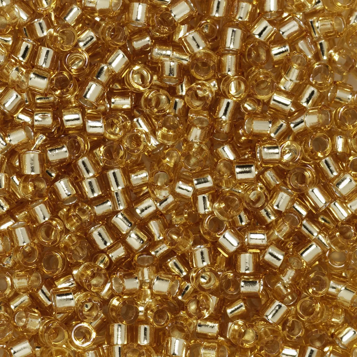 TOHO-perler 11/0 – topaz transparent, 22 Silverlined light topaz