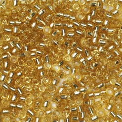 TOHO-perler runde 11/0 – klar topas, 22 Silver lined light topaz